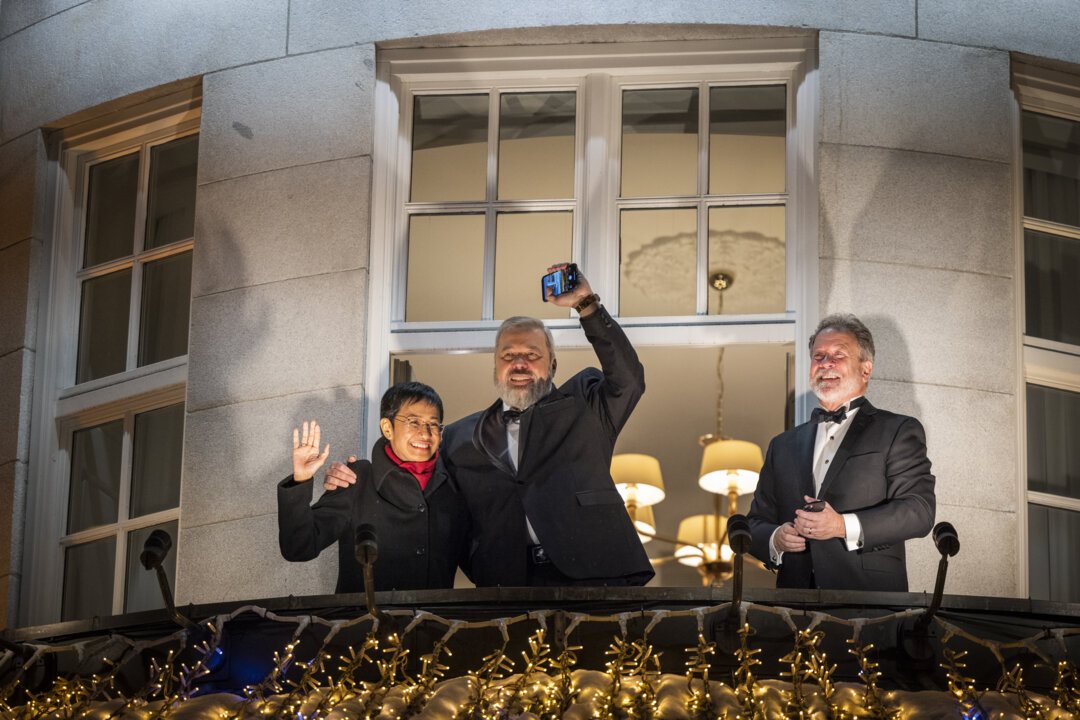 Laureates at the Grand Hotel balcony