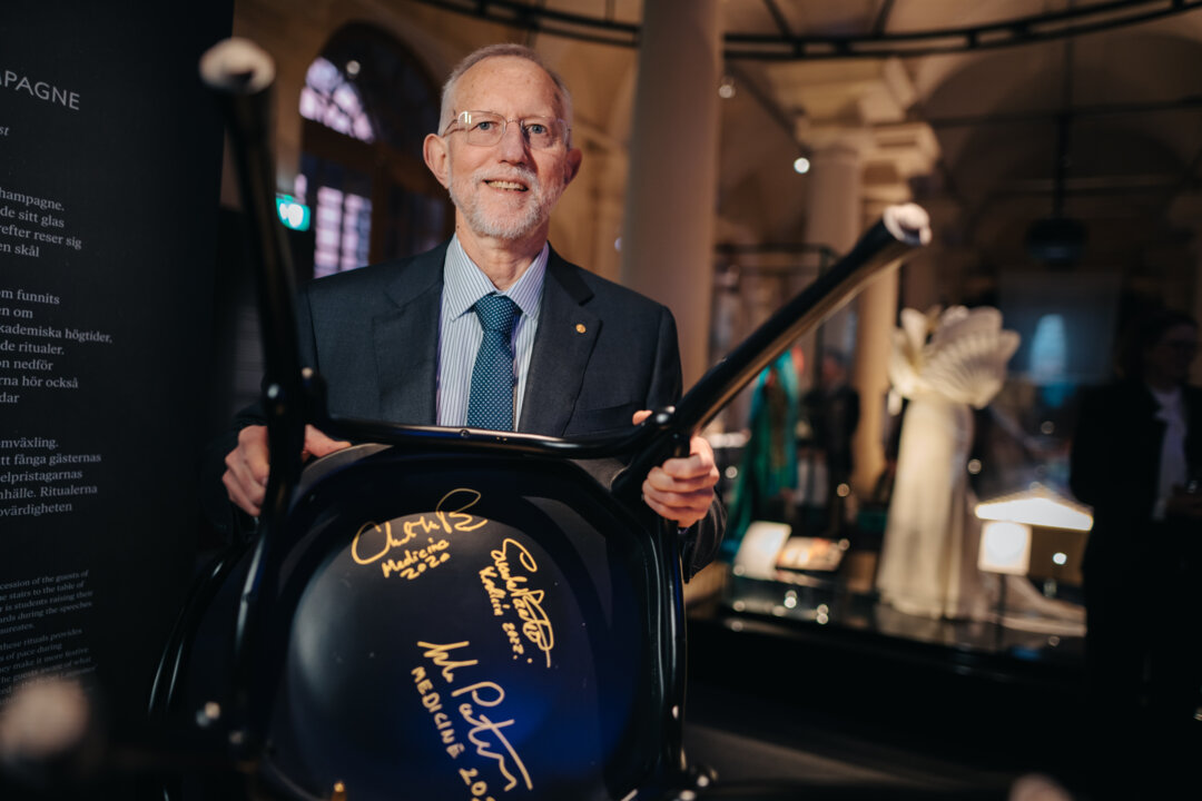 Charles M. Rice and a signed chair